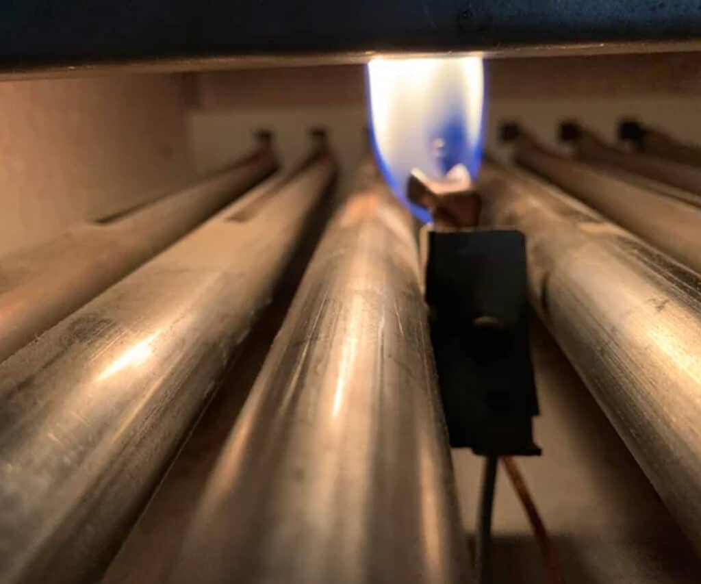 yellow pilot light inside furnace