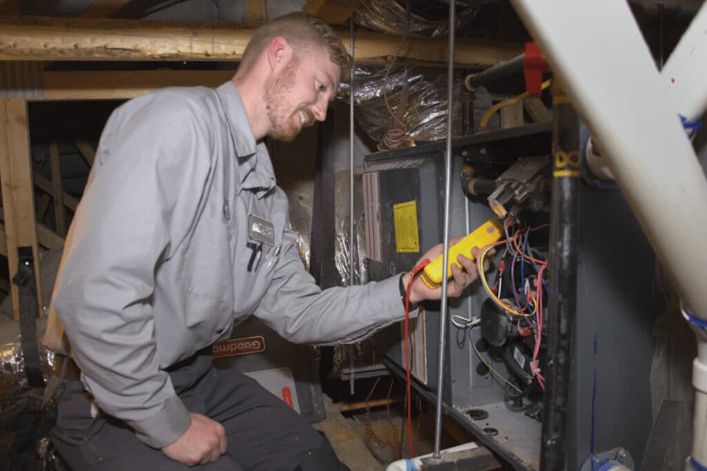 Sunrise's Technician working on furnace