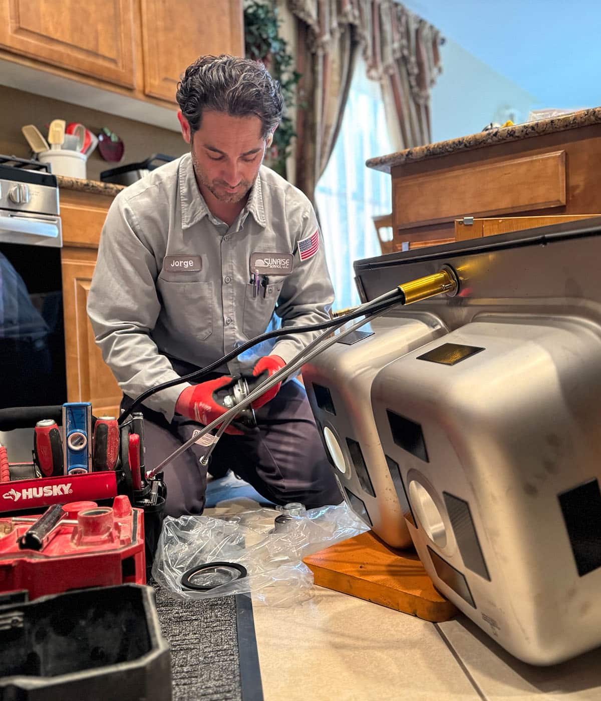 sunrise plumber installing sink