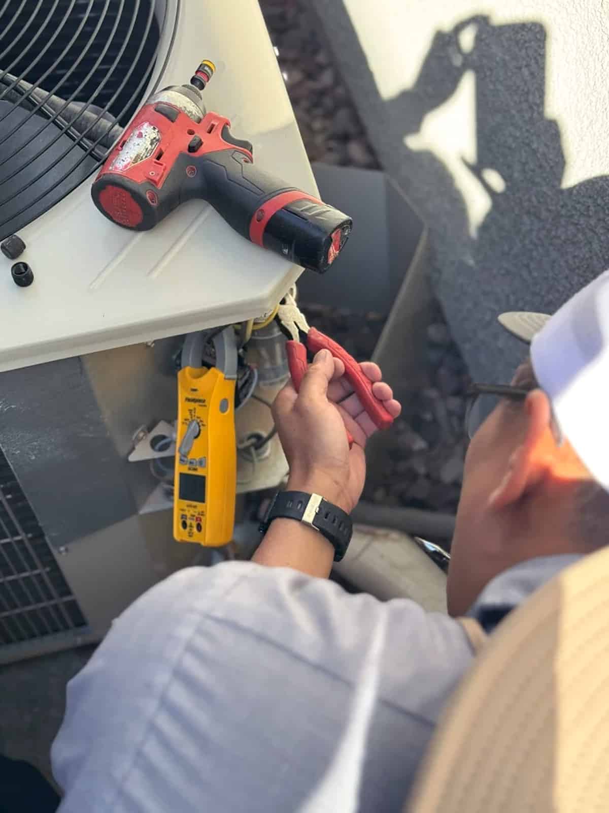 Close-up of a technician working on an air conditioning system